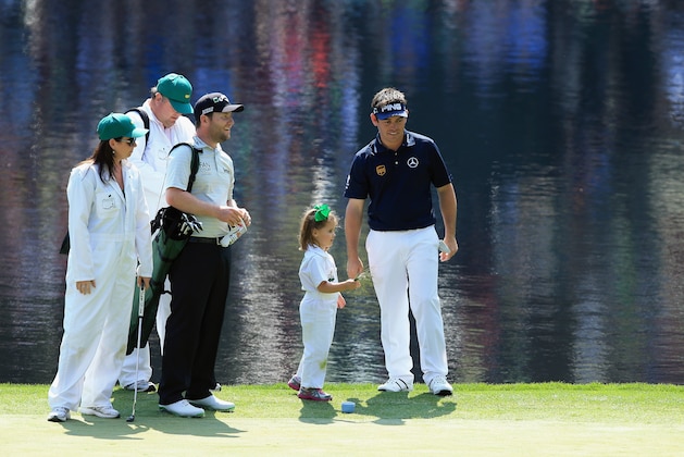 AUGUSTA, GA - APRIL 09:  Louis Oosthuizen of South Africa waits on a green alongside Branden Grace of South Africa during the 2014 Par 3 Contest prior to the start of the 2014 Masters Tournament at Augusta National Golf Club on April 9, 2014 in Augusta, Georgia.  (Photo by David Cannon/Getty Images)