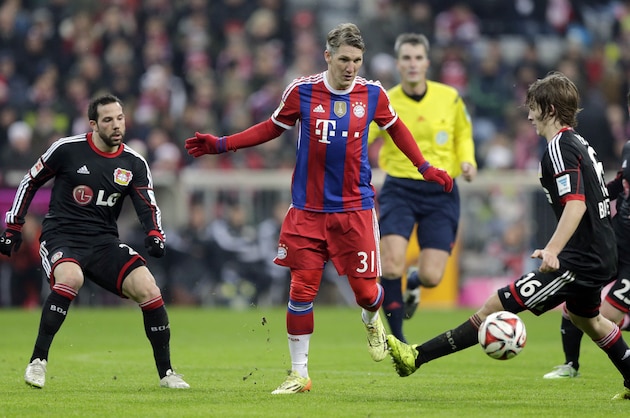 Bayern's Bastian Schweinsteiger kicks the ball during the German first division Bundesliga soccer match between FC Bayern and Bayer Leverkusen 04 in the Allianz Arena in Munich, Germany, on Saturday, Dec. 6, 2014. (AP Photo/Matthias Schrader)