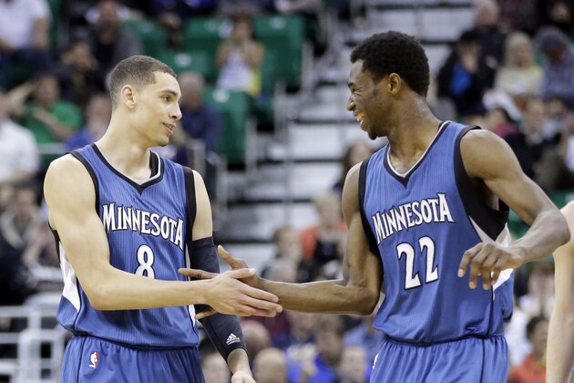 Minnesota Timberwolves' Andrew Wiggins (22) congratulates Zach LaVine (8) after LaVine made a 3-pointer in the fourth quarter of an NBA basketball game against the Utah Jazz, Monday, March 23, 2015, in Salt Lake City. The Timberwolves won 106-104 in overtime. (AP Photo/Rick Bowmer)