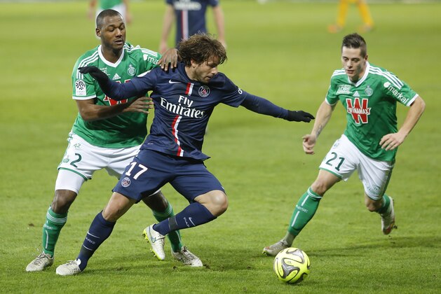 Paris Saint Germain's Maxwel Scherrer Cabelino Andrade, center, challenges for the ball with Saint-Etienne's Kevin Theophile Catherine, left, and Romain Hamouma, right, during their French League One soccer match in Saint-Etienne, central France, Sunday, Jan. 25, 2015. (AP Photo/Laurent Cipriani)