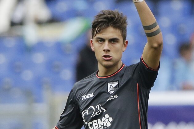 Palermo’s Paulo Dybala celebrates after he scored during a Serie A soccer match between Roma and Palermo, at Rome's Olympic Stadium, Sunday, Feb. 22, 2015. (AP Photo/Andrew Medichini)