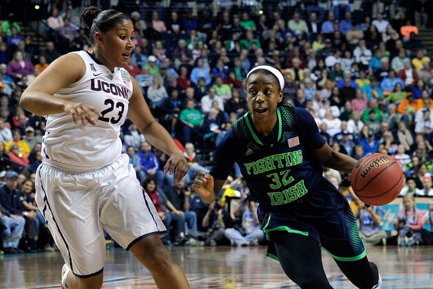 NASHVILLE, TN - APRIL 08:  Jewell Loyd #32 of the Notre Dame Fighting Irish dribbles against Kaleena Mosqueda #23 of the Connecticut Huskies during the NCAA Women's Basketball Tournament Championship game at Bridgestone Arena on April 8, 2014 in Nashville, Tennessee.  (Photo by Frederick Breedon/Getty Images)