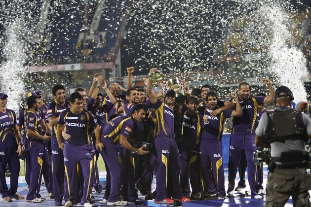 Players and support staff of Kolkata Knight Riders celebrate with the trophy after their win against Chennai Super Kings' in the Indian Premier League (IPL) final cricket match in Chennai, India, Sunday, May 27, 2012.  Kolkata Knight Riders won the match by five wickets. (AP Photo/Aijaz Rahi)