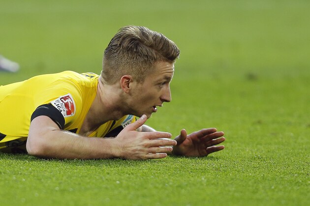 Dortmund's Marco Reus gestures during the German first division Bundesliga soccer match between BvB Borussia Dortmund  and Bayern Munich in Dortmund, Germany, Saturday, April 4, 2015. (AP Photo/Frank Augstein)