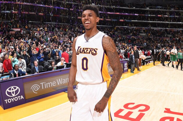 LOS ANGELES, CA - FEBRUARY 22:  Nick Young #0 of the Los Angeles Lakers celebrates after the game against the Boston Celtics on February 22, 2015 at Staples Center in Los Angeles, California. NOTE TO USER: User expressly acknowledges and agrees that, by downloading and or using this Photograph, user is consenting to the terms and conditions of the Getty Images License Agreement. Mandatory Copyright Notice: Copyright 2015 NBAE (Photo by Andrew D. Bernstein/NBAE via Getty Images)