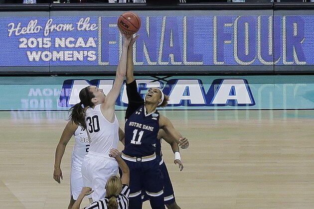 Notre Dame forward Brianna Turner (11) and Connecticut forward Breanna Stewart (30) tip off the ball during the first half of the NCAA women's Final Four tournament college basketball championship game, Tuesday, April 7, 2015, in Tampa, Fla. (AP Photo/Chris O'Meara)