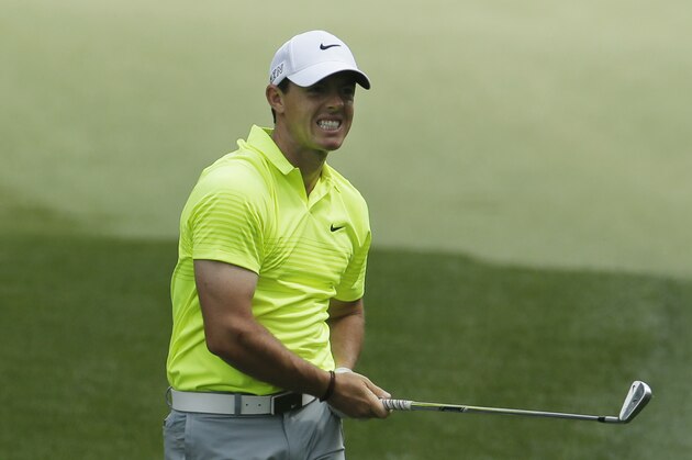 Rory McIlroy, of Northern Ireland, watches his shot to the 13th green during a practice round for the Masters golf tournament Tuesday, April 7, 2015, in Augusta, Ga. (AP Photo/Charlie Riedel)