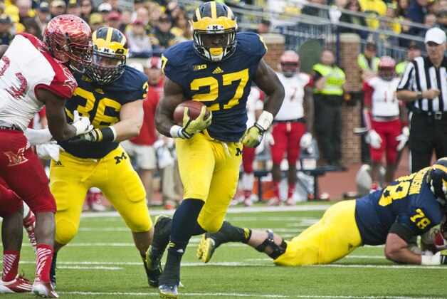 Michigan running back Derrick Green (27) rushes in the fourth quarter of an NCAA college football game against Miami (Ohio) in Ann Arbor, Mich., Saturday, Sept. 13, 2014. (AP Photo/Tony Ding)