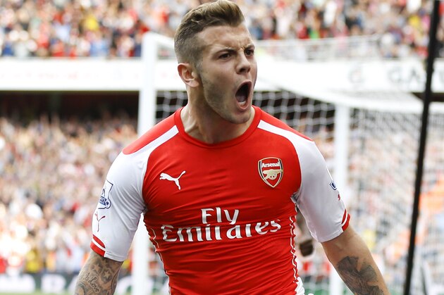Arsenal's Jack Wilshere celebrates scoring a goal during the English Premier League soccer match between Arsenal and Manchester City at Emirates Stadium in London, Saturday, Sept. 13, 2014. (AP Photo/Kirsty Wigglesworth)