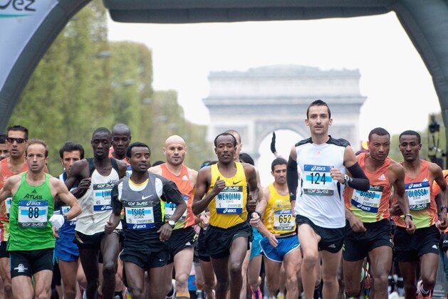 PARIS, FRANCE - APRIL 15: Competitors run during the 36th Paris Marathon on April 15, 2012 in Paris, France. (Photo by Trago/Getty Images) PARIS, FRANCE - APRIL 15: Competitors run during the 36th Paris Marathon on April 15, 2012 in Paris, France. (Photo by Trago/Getty Images)