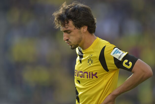Dortmund's Mats Hummels reacts during the German Bundesliga soccer match between Borussia Dortmund and Hamburger SV in Dortmund, Germany, Saturday, Oct. 4, 2014. Dortmund was defeated by Hamburg with 0-1. (AP Photo/Martin Meissner) Dortmund's Mats Hummels reacts during the German Bundesliga soccer match between Borussia Dortmund and Hamburger SV in Dortmund, Germany, Saturday, Oct. 4, 2014. Dortmund was defeated by Hamburg with 0-1. (AP Photo/Martin Meissner)