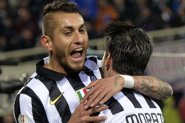 Juventus' Roberto Pereyra with his teammate Alvaro Morata celebrates after scoring during an Italian Cup semifinal return soccer match between Juventus and Fiorentina,  at the Artemio Franchi stadium in Florence, Italy, April 7, 2015. (AP Photo/Maurizio Degl' Innocenti) ITALY OUT