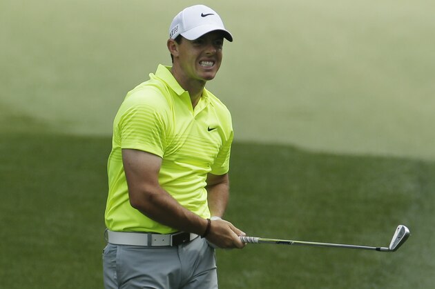 Rory McIlroy, of Northern Ireland, watches his shot to the 13th green during a practice round for the Masters golf tournament Tuesday, April 7, 2015, in Augusta, Ga. (AP Photo/Charlie Riedel)