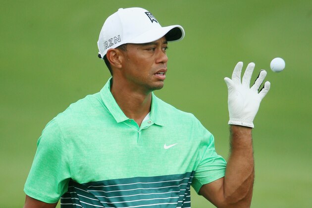 AUGUSTA, GA - APRIL 08:  Tiger Woods of the United States reaches for a golf ball on the practice ground during a practice round prior to the start of the 2015 Masters Tournament at Augusta National Golf Club on April 8, 2015 in Augusta, Georgia.  (Photo by Andrew Redington/Getty Images)