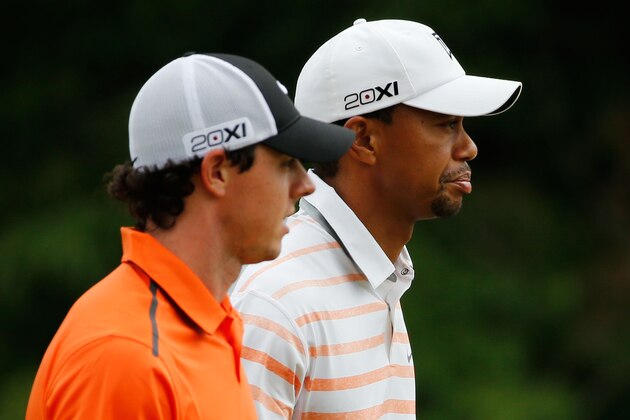 ARDMORE, PA - JUNE 14:  (L-R) Rory McIlroy of Northern Ireland and Tiger Woods of the United States walk up the tenth hole during Round Two of the 113th U.S. Open at Merion Golf Club on June 14, 2013 in Ardmore, Pennsylvania.  (Photo by Rob Carr/Getty Images)