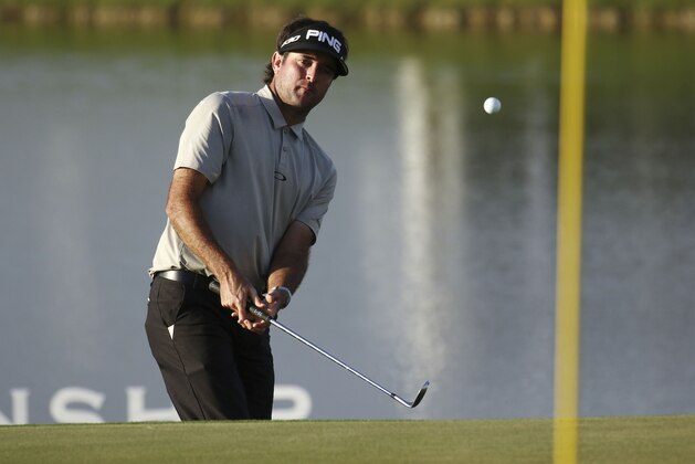 Bubba Watson chips onto the 18th green during the second round the Cadillac Championship golf tournament in Doral, Fla., Friday, March 6, 2015. (AP Photo/J Pat Carter)