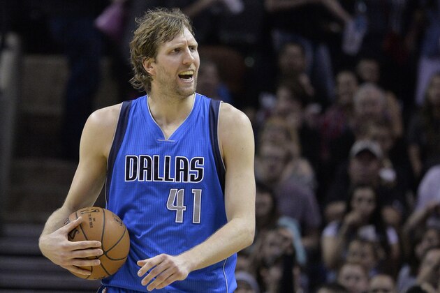 Dallas Mavericks forward Dirk Nowitzki reacts after being called for a foul during the second half of an NBA basketball game against the San Antonio Spurs, Friday, March 27, 2015, in San Antonio. San Antonio won 94-76. (AP Photo/Darren Abate)