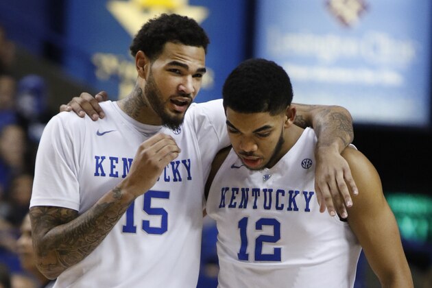 Kentucky's Willie Cauley-Stein (15) talks to teammate Karl-Anthony Towns (12) during a time-out in the first half of an NCAA college basketball game against Alabama, Saturday, Jan. 31, 2015, in Lexington, Ky. Kentucky won 70-55. (AP Photo/James Crisp)