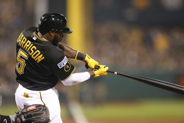 Oct 1, 2014; Pittsburgh, PA, USA; Pittsburgh Pirates third baseman Josh Harrison (5) hits a single against the San Francisco Giants during the sixth inning of the 2014 National League Wild Card playoff baseball game at PNC Park. Mandatory Credit: Charles LeClaire-USA TODAY Sports