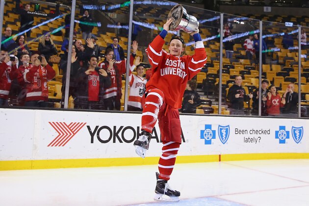 BOSTON, MA - FEBRUARY 23: Jack Eichel #9 of the Boston University Terriers celebrates with the Beanpot trophy following the 4-3 win over the Northeastern Huskies during over time at the 2015 Beanpot Tournament Championship game at TD Garden on February 23, 2015 in Boston, Massachusetts.  (Photo by Maddie Meyer/Getty Images)
