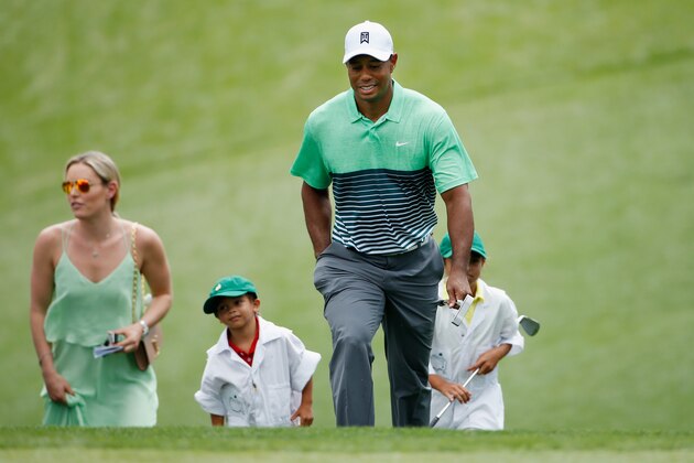 AUGUSTA, GA - APRIL 08:  Tiger Woods of the United States walks alongside his girlfriend Lindsey Vonn, son Charlie and daughter Sam during the Par 3 Contest prior to the start of the 2015 Masters Tournament at Augusta National Golf Club on April 8, 2015 in Augusta, Georgia.  (Photo by Ezra Shaw/Getty Images)
