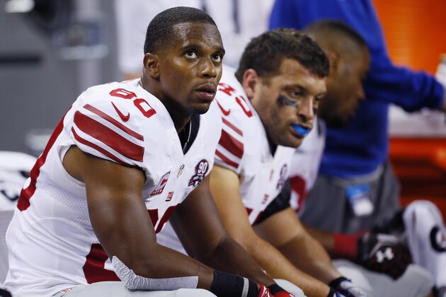 New York Giants wide receiver Victor Cruz (80) and fullback Henry Hynoski sit on the bench during the fourth quarter of an NFL football game against the Detroit Lions in Detroit, Monday, Sept. 8, 2014. The Lions defeated the Giants, 35-14. (AP Photo/Paul Sancya)
