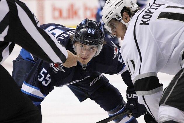 WINNIPEG, MB - OCTOBER 4: Mark Scheifele #55 of the Winnipeg Jets prepares for a faceoff with Anze Kopitar #11 of the Los Angeles Kings in second period action during an NHL home opener game at the MTS Centre on October 4, 2013 in Winnipeg, Manitoba, Canada. (Photo by Marianne Helm/Getty Images) WINNIPEG, MB - OCTOBER 4: Mark Scheifele #55 of the Winnipeg Jets prepares for a faceoff with Anze Kopitar #11 of the Los Angeles Kings in second period action during an NHL home opener game at the MTS Centre on October 4, 2013 in Winnipeg, Manitoba, Canada. (Photo by Marianne Helm/Getty Images)