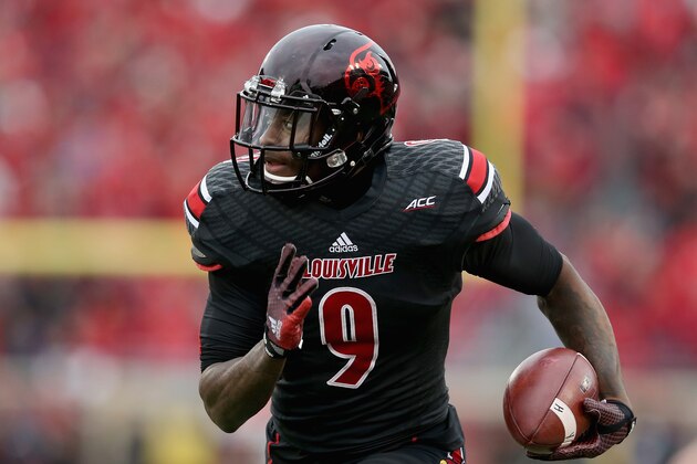 LOUISVILLE, KY - NOVEMBER 29:  DeVante Parker #9 of the Louisville Cardinals runs for a touchdown during the game against the Kentucky Wildcats at Papa John's Cardinal Stadium on November 29, 2014 in Louisville, Kentucky.  (Photo by Andy Lyons/Getty Images)