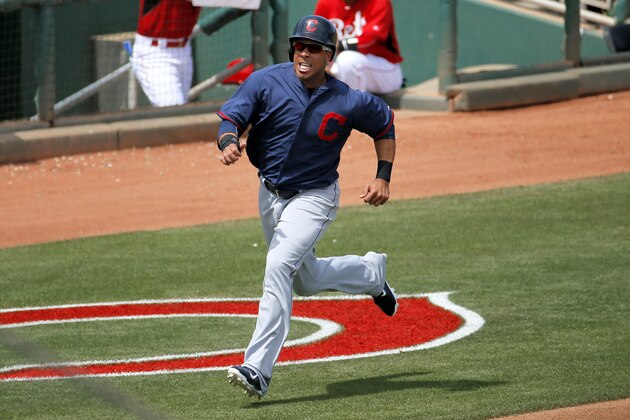 Cleveland Indians' Michael Brantley scores on an RBI double by teammate Roberto Perez during the fourth inning of a spring training baseball game against the Cincinnati Reds, Thursday, April 2, 2015, in Goodyear, Ariz. (AP Photo/Matt York)