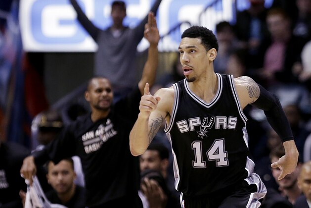San Antonio Spurs' Danny Green gestures after hitting a three-point basket in the fourth quarter of an NBA basketball game against the Atlanta Hawks Sunday, March 22, 2015, in Atlanta. The Spurs won 114-95. (AP Photo/David Goldman)