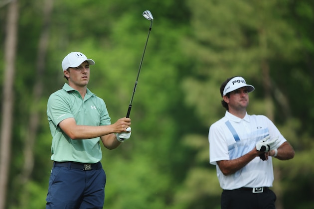 AUGUSTA, GA - APRIL 13: Jordan Spieth of the United States watches his tee shot on the 12th hole as Bubba Watson looks on during the final round of the 2014 Masters Tournament at Augusta National Golf Club on April 13, 2014 in Augusta, Georgia.  (Photo by Andrew Redington/Getty Images)