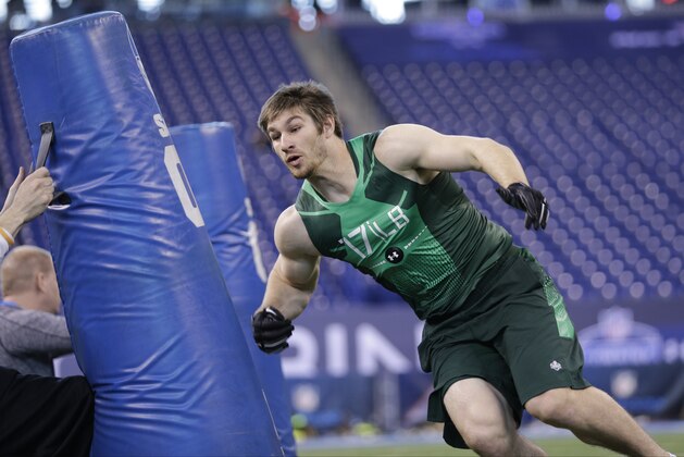 Penn State linebacker Mike Hull runs a drill at the NFL football scouting combine in Indianapolis, Sunday, Feb. 22, 2015. (AP Photo/David J. Phillip)