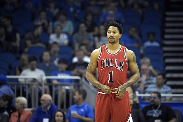Chicago Bulls guard Derrick Rose (1) stands on the court during the first half of an NBA basketball game against the Orlando Magic in Orlando, Fla., Wednesday, April 8, 2015.(AP Photo/Phelan M. Ebenhack)