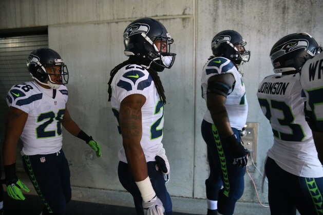Seattle Seahawks' Richard Sherman walks onto the field before an NFL football game against the Philadelphia Eagles, Sunday, Dec. 7, 2014, in Philadelphia. (AP Photo/Matt Rourke)