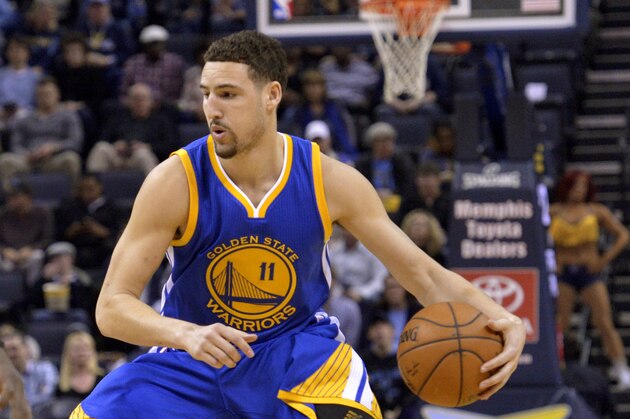 Golden State Warriors guard Klay Thompson (11) plays in the first half of an NBA basketball game Friday, March 27, 2015, in Memphis, Tenn. (AP Photo/Brandon Dill)