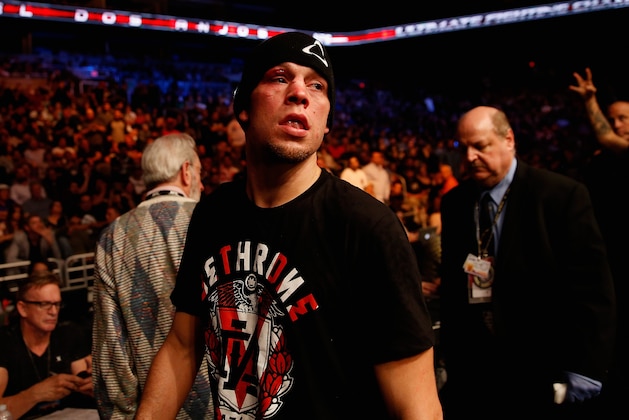 PHOENIX, AZ - DECEMBER 13:  Nate Diaz exits the octagon following his loss by unanimous decision to Rafael dos Anjos (not pictured) in their heavyweight bout during the UFC Fight Night event at the at U.S. Airways Center on December 13, 2014 in Phoenix, Arizona.  (Photo by Christian Petersen/Getty Images)