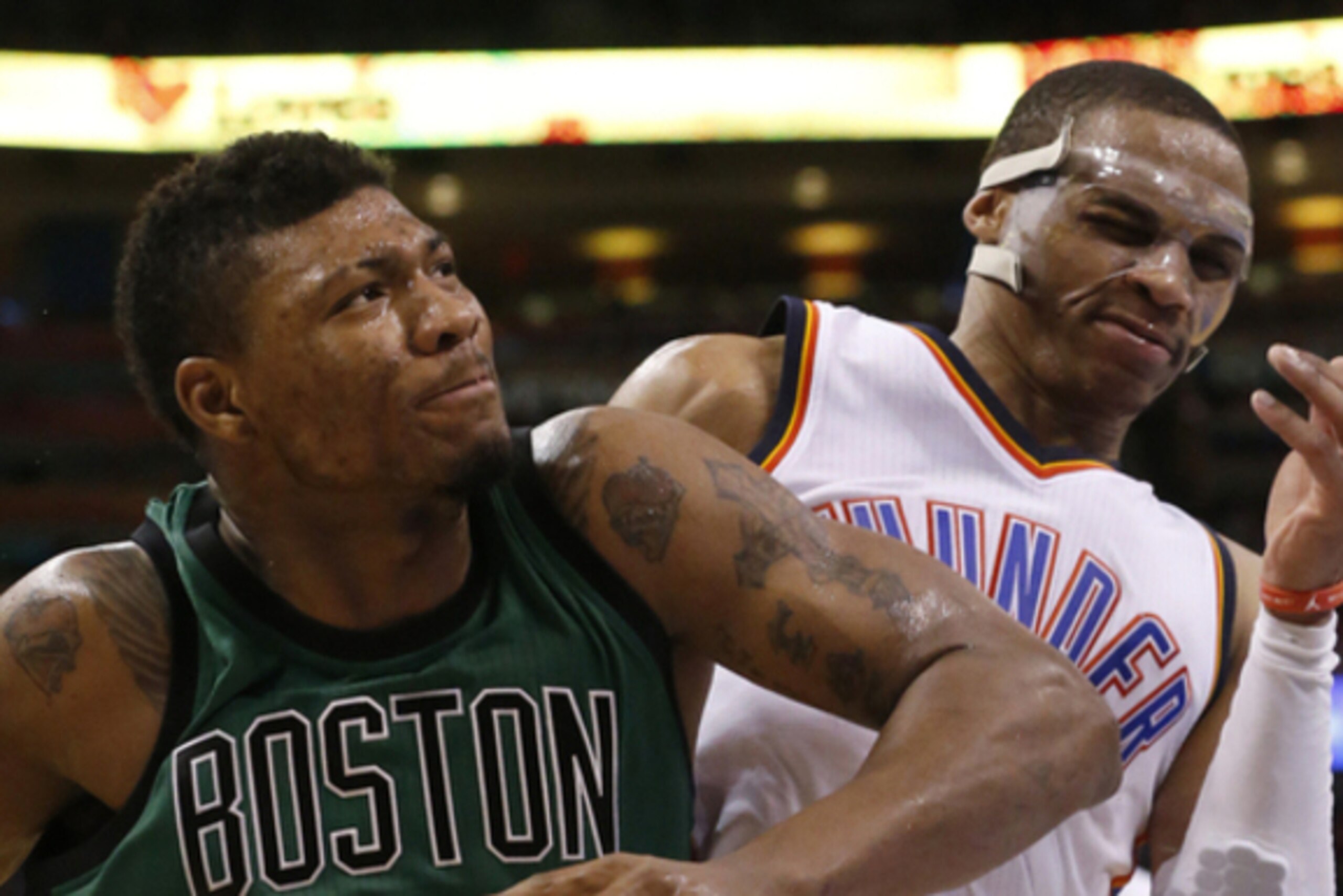 Boston Celtics guard Marcus Smart (36) drives around Oklahoma City Thunder guard Russell Westbrook, right, in the fourth quarter of an NBA basketball game in Oklahoma City, Wednesday, March 18, 2015. Oklahoma City won 122-118. (AP Photo/Sue Ogrocki) Boston Celtics guard Marcus Smart (36) drives around Oklahoma City Thunder guard Russell Westbrook, right, in the fourth quarter of an NBA basketball game in Oklahoma City, Wednesday, March 18, 2015. Oklahoma City won 122-118. (AP Photo/Sue Ogrocki)