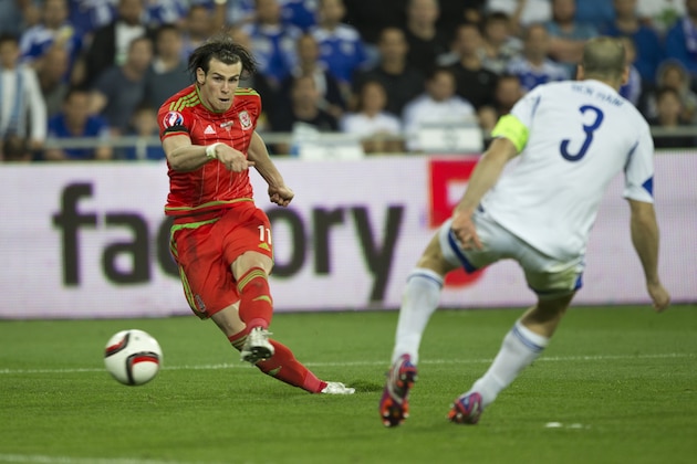 Wales' Gareth Bale makes a free kick against Israel during Euro 2016 group B qualifying soccer match in Haifa, Israel, Saturday, March 28, 2015. (AP Photo/Ariel Schalit)