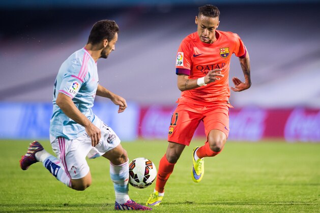 VIGO, SPAIN - APRIL 05: Neymar Santos Jr of FC Barcelona and Jonathan Castro 'Jonny' of Celta Vigo fight for the ball during the La Liga match between Celta Vigo and FC Barcelona at Estadio Balaidos on April 5, 2015 in Vigo, Spain. (Photo by Alex Caparros/Getty Images)