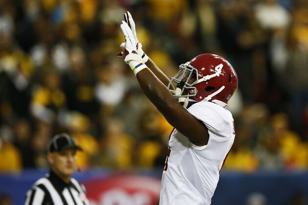 ATLANTA, GA - DECEMBER 06:  T.J. Yeldon #4 of the Alabama Crimson Tide celebrates his touchdown against the Missouri Tigers in the first quarter of the SEC Championship game at the Georgia Dome on December 6, 2014 in Atlanta, Georgia.  (Photo by Kevin C. Cox/Getty Images)