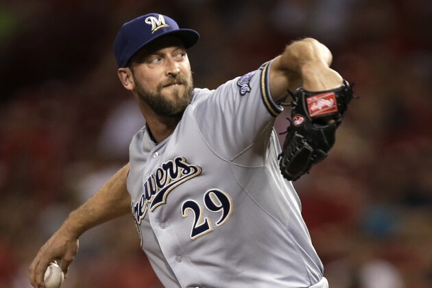 Milwaukee Brewers relief pitcher Jim Henderson throws against the Cincinnati Reds in the ninth inning of a baseball game, Friday, Aug. 23, 2013, in Cincinnati. Henderson earned his 20th save as Milwaukee won 6-4. (AP Photo/Al Behrman)
