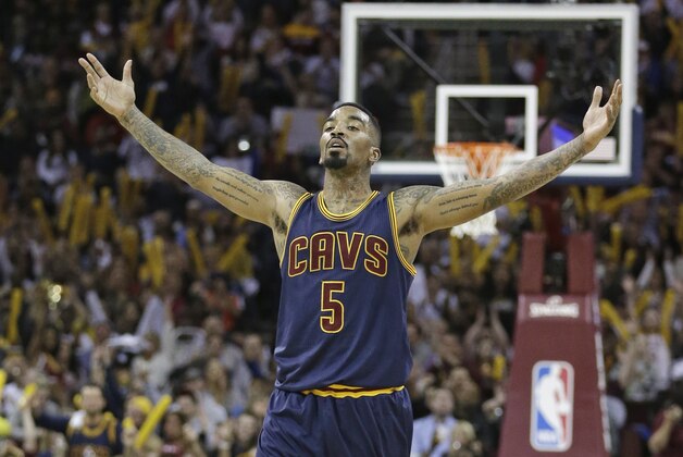Cleveland Cavaliers' J.R. Smith reacts after making a three point shot during the fourth quarter of an NBA basketball game against the Cleveland Cavaliers Thursday, April 2, 2015, in Cleveland. The Cavaliers defeated the Heat 114-88. (AP Photo/Tony Dejak)