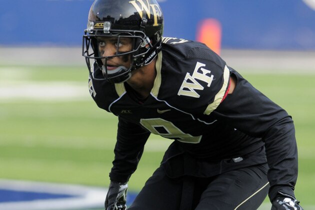 Wake Forest cornerback Kevin Johnson (9) lines up to cover a Utah State receiver during an NCAA football game, Saturday, Sept. 13, 2014, in Logan, Utah. (AP Photo/Eli Lucero)