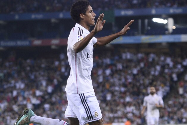 Real Madrid's Raphael Varane reacts after scoring his second goal against Cornella during a Copa del Rey soccer match in Cornella Llobregat, Spain, Wednesday, Oct. 29, 2014. (AP Photo/Manu Fernandez)