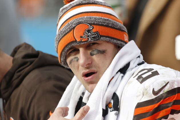 Cleveland Browns' Johnny Manziel (2) on the bench during the second half of an NFL football game against the Carolina Panthers in Charlotte, N.C., Sunday, Dec. 21, 2014. The Panthers won 17-13. (AP Photo/Bob Leverone)