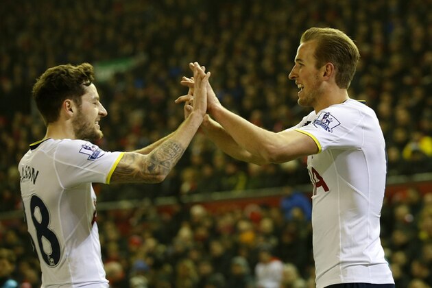 Tottenham's Harry Kane, right, celebrates scoring with teammate Ryan Mason during the English Premier League soccer match between Liverpool and Tottenham Hotspur at Anfield Stadium, Liverpool, England, Tuesday Feb. 10, 2015. (AP Photo/Jon Super)