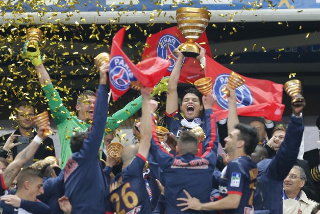 Paris Saint Germain's Thiago Motta, center, of Italy, and teammates celebrate with the cup after winning their French League Cup final soccer match against Lyon at the Stade de France in Saint Denis, north of Paris, Saturday April 19, 2014. (AP Photo/Jacques Brinon) Paris Saint Germain's Thiago Motta, center, of Italy, and teammates celebrate with the cup after winning their French League Cup final soccer match against Lyon at the Stade de France in Saint Denis, north of Paris, Saturday April 19, 2014. (AP Photo/Jacques Brinon)