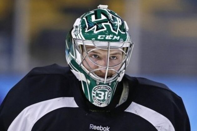 North Dakota goalie Zane McIntyre looks down ice during an NCAA hockey practice before the Frozen Four tournament in Boston, Wednesday, April 8, 2015.  North Dakota will face Boston University in Thursday's semifinal game. (AP Photo/Charles Krupa)