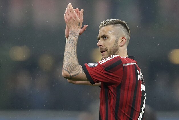 AC Milan's Jeremy Menez celebrates at the end of the Serie A soccer match between AC Milan and Cagliari at the San Siro stadium in Milan, Italy, Saturday, March 21, 2015. AC Milan won 3-1.(AP Photo/Antonio Calanni)