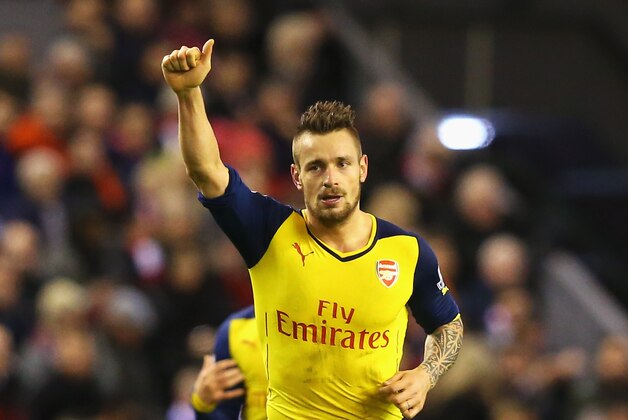 LIVERPOOL, ENGLAND - DECEMBER 21: Mathieu Debuchy of Arsenal celebrates scoring his goal during the Barclays Premier League match between Liverpool and Arsenal at Anfield on December 21, 2014 in Liverpool, England.  (Photo by Alex Livesey/Getty Images)